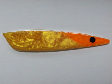 Pearly gold rocket with orange head and black eye